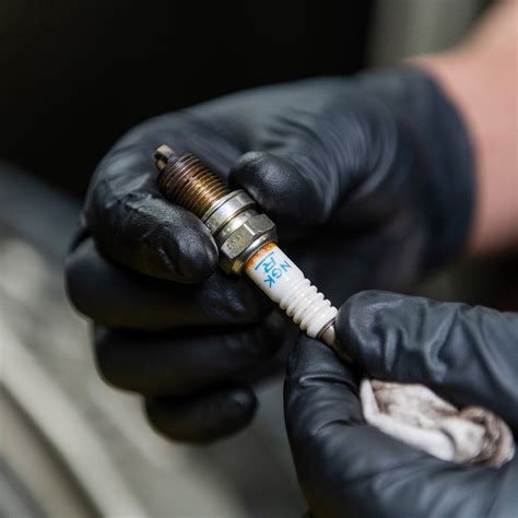 Tesla spark plug replacement cost